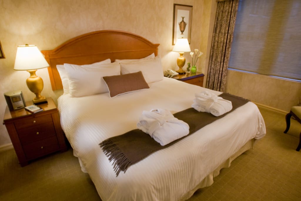 King bedroom. Private full bathroom here, closet space, and additional TV.