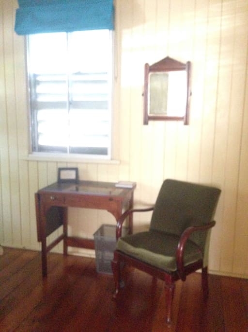 With a chair and desk