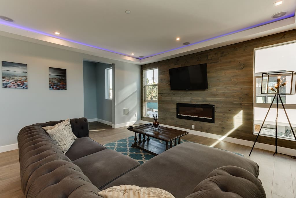 living rom with smart tv, wifi, and fireplace