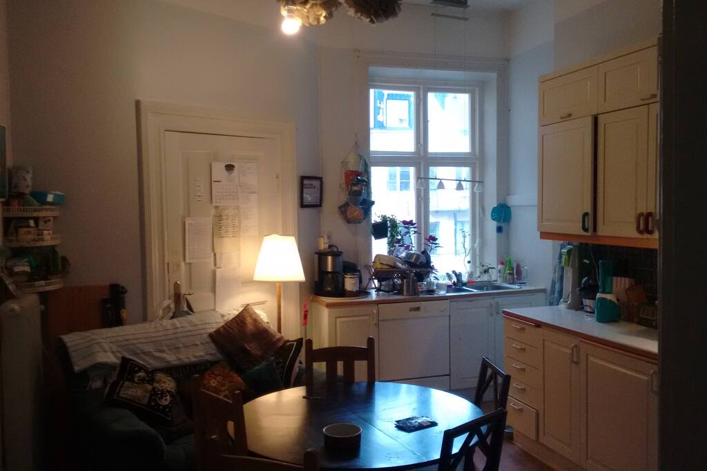 The shared kitchen, with eating area and a couch