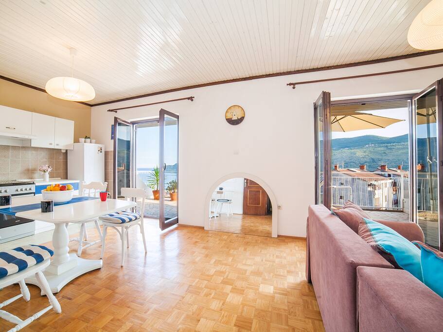 Living room and kitchen with sea view