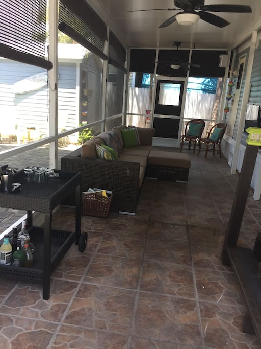 Screened-In Patio with Sectional Sofa & TV