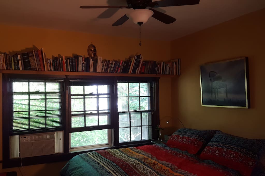 Lots of light with shades, ceiling fan, and air conditioner.