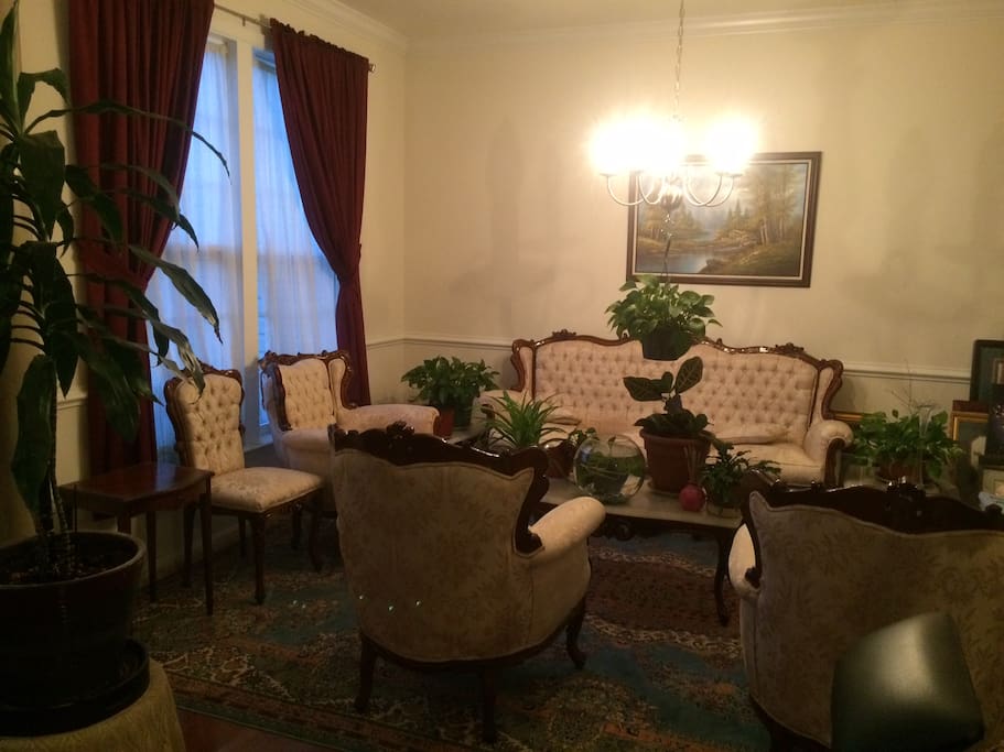 Formal living room with hand curved furniture