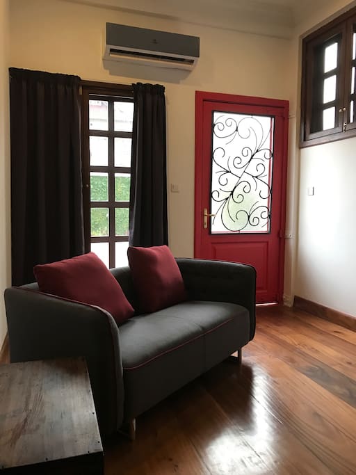 Close up perspective of sofa by front door.