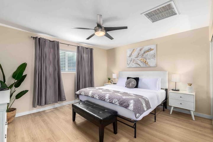 Primary Bedroom King memory foam mattress, smart TV, private bathroom, dresser and closet storage space. 