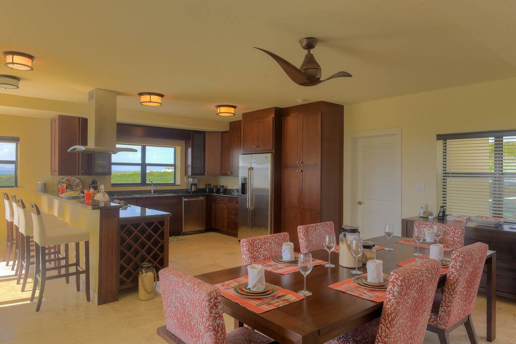 Open plan great room with indoor dining and bar