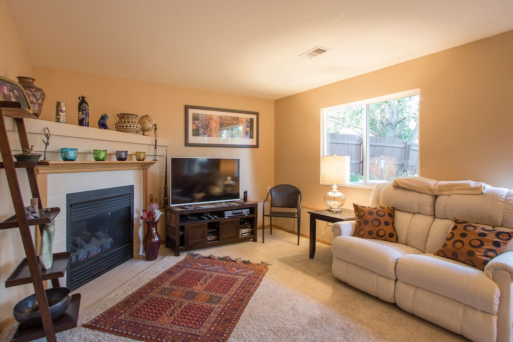 Family room has gas fireplace, 50" TV with DishNetwork satellite service plus Netflix