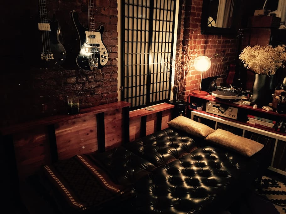 Foldable leather futon that easily sleeps 2 - integrated USB jacks on all outlets.