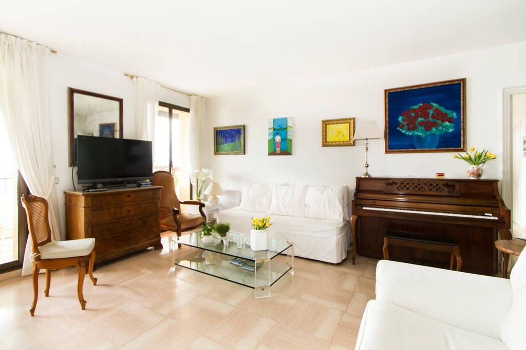 The living-room with a piano, 1 large TV set including Netflix and a XBox 360