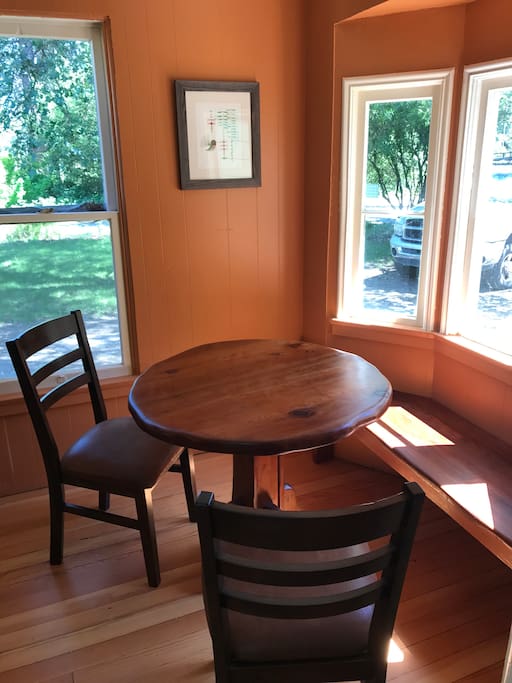 Kitchen nook. Custom made table and bench from reclaimed redwood.