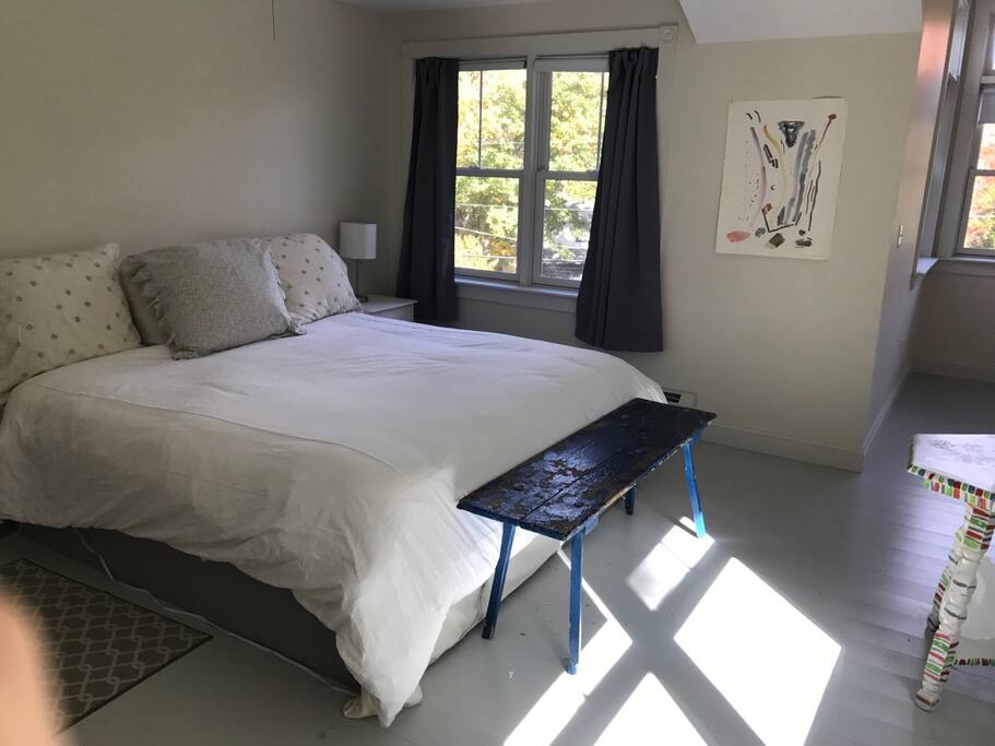 Master bedroom with queen bed and sea views