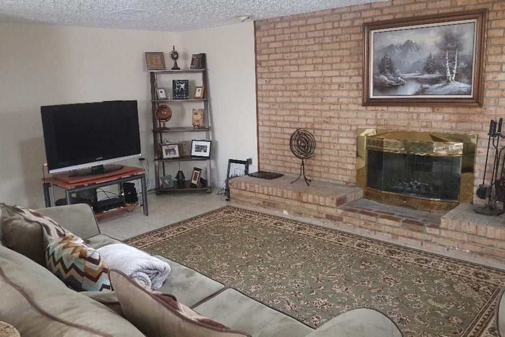 Family room with fireplace and tv for family time or relaxation