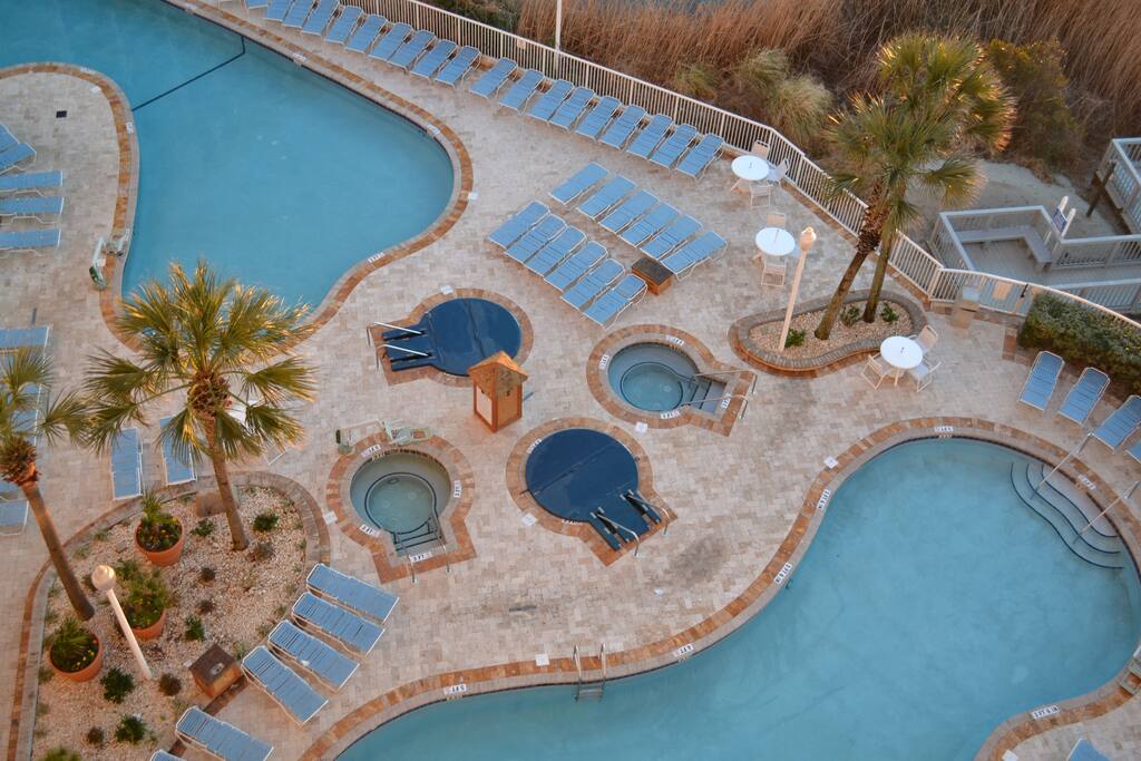 Side view from balcony of pools and hot tubs