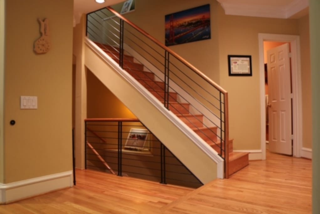 Staircase with half bath shown