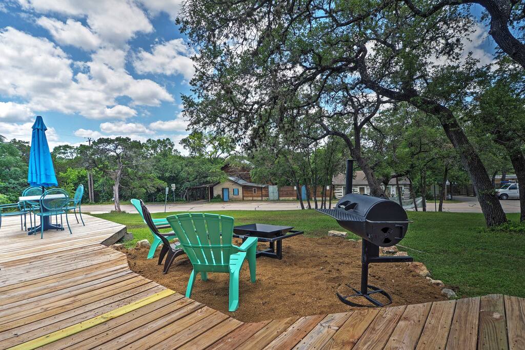 The home features a furnished deck and a spacious front lawn, perfect for relaxing in the fresh air.