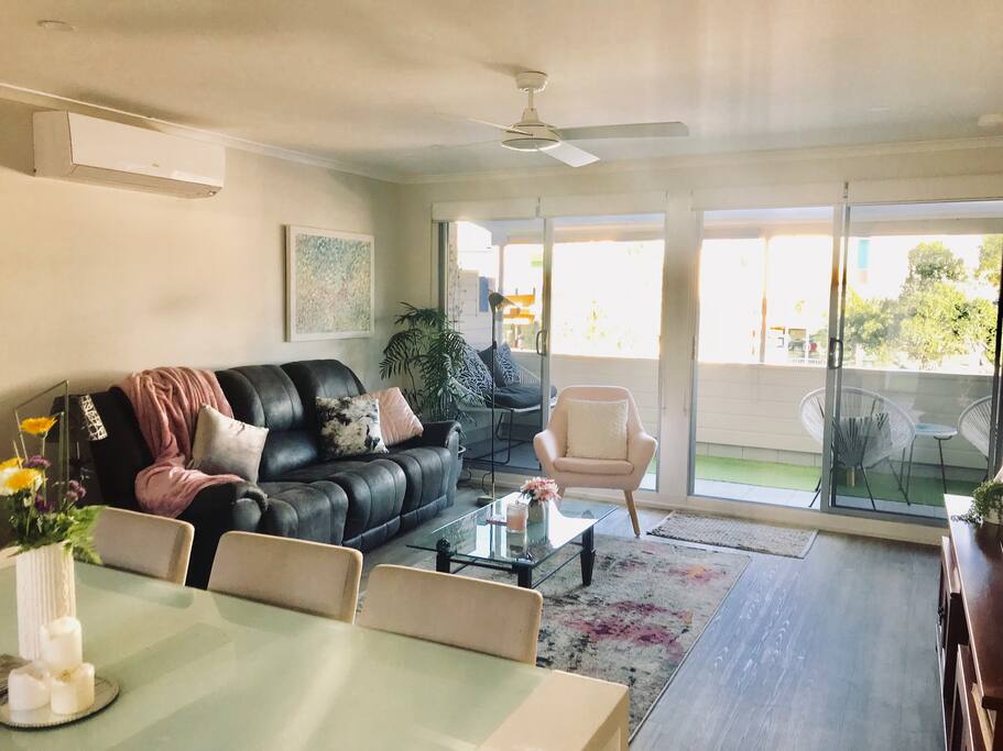 Living room leading out to deck overlooking Noosa River