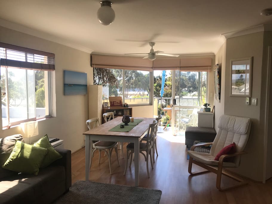 Bright airy open plan living area with ocean views and tree top outlook