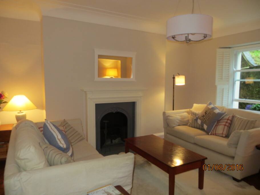 Large sitting room with 2 sofas , tv & dvd player