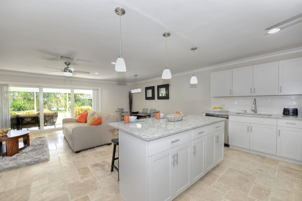 Open living, kitchen island, view to greenbelt