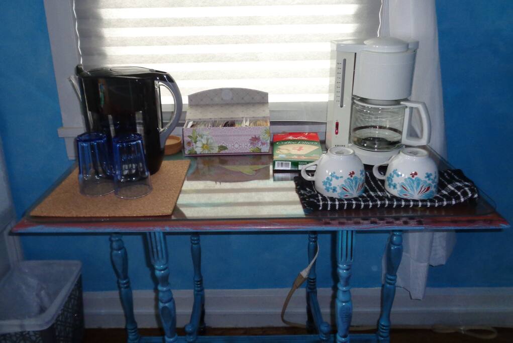 Coffee and tea station . Room darkening shades for late risers