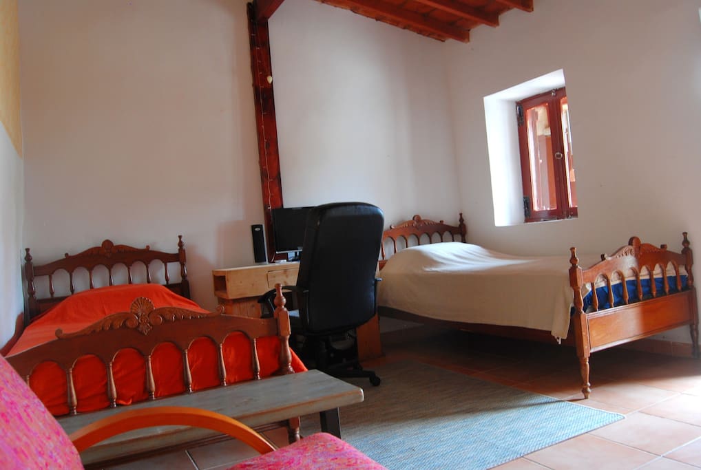 Your room with two single beds. It has private entrance