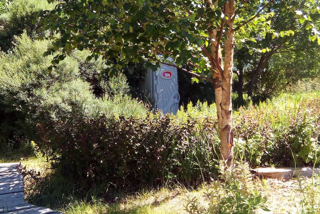 Private Porta-Potty across little bridge