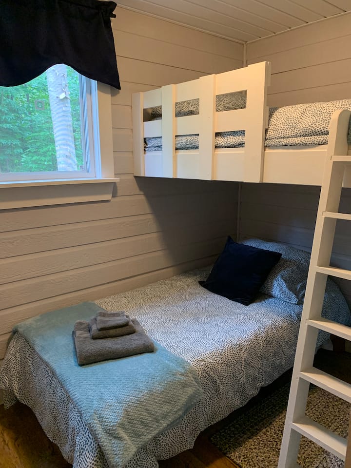 Cozy room with twin bed and bunk. Perfect for two kids or one adult. 