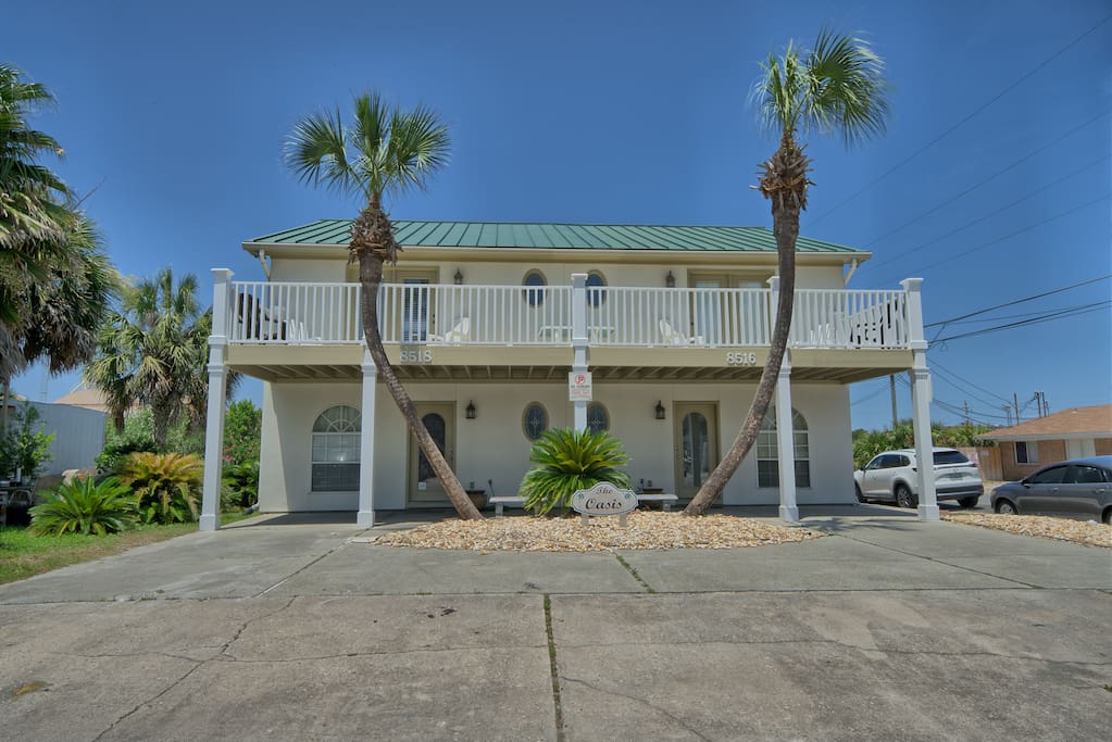 Beautiful home located right across the beach with pool and hot tub.