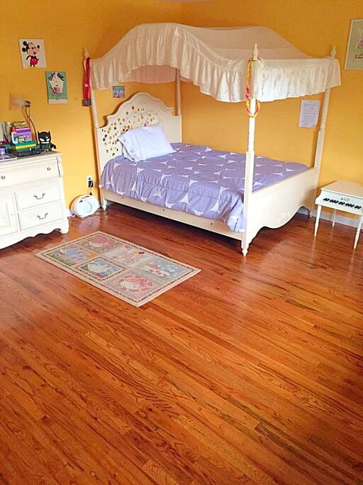 Another view of the large bedroom with full sized bed