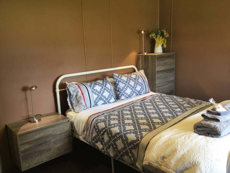 Bedroom with queen bed & idyllic country views