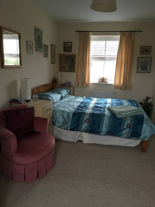 Bedroom has two windows - two radiators under each