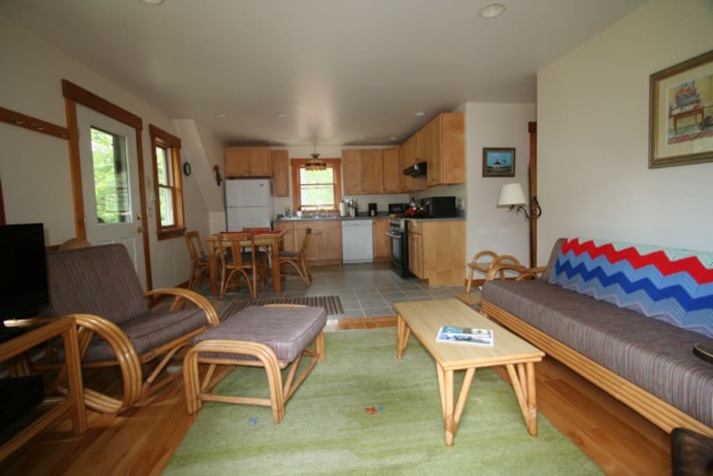 Living room & Kitchen. TV Monitor on left with 24/7 WiFi + Roku