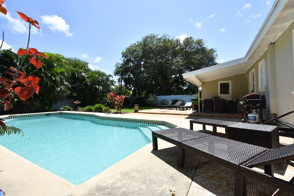 private pool, lounge chairs, covered outdoor dining, beautiful landscaping