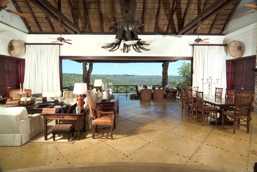 Main Lodge sitting room with fire place and dining room