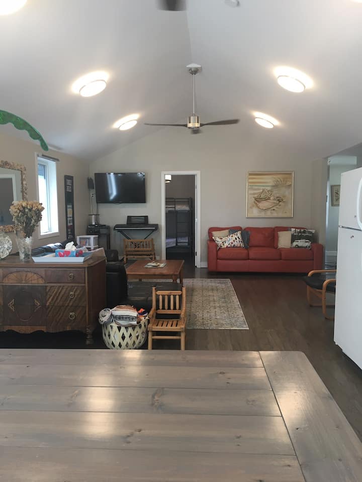 Extra comfy living room and seating for 10 people!  Very comfy queen hide a bed!  The ceiling fans and portable AC keeps this space nice and comfy in the summer.