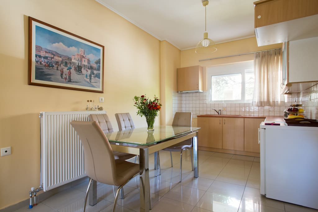 Kitchen and dining area with big dinning table, which can be opened to accommodate up to 8 people.