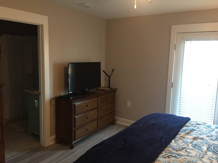 Upstairs master bedroom has king bed and private deck