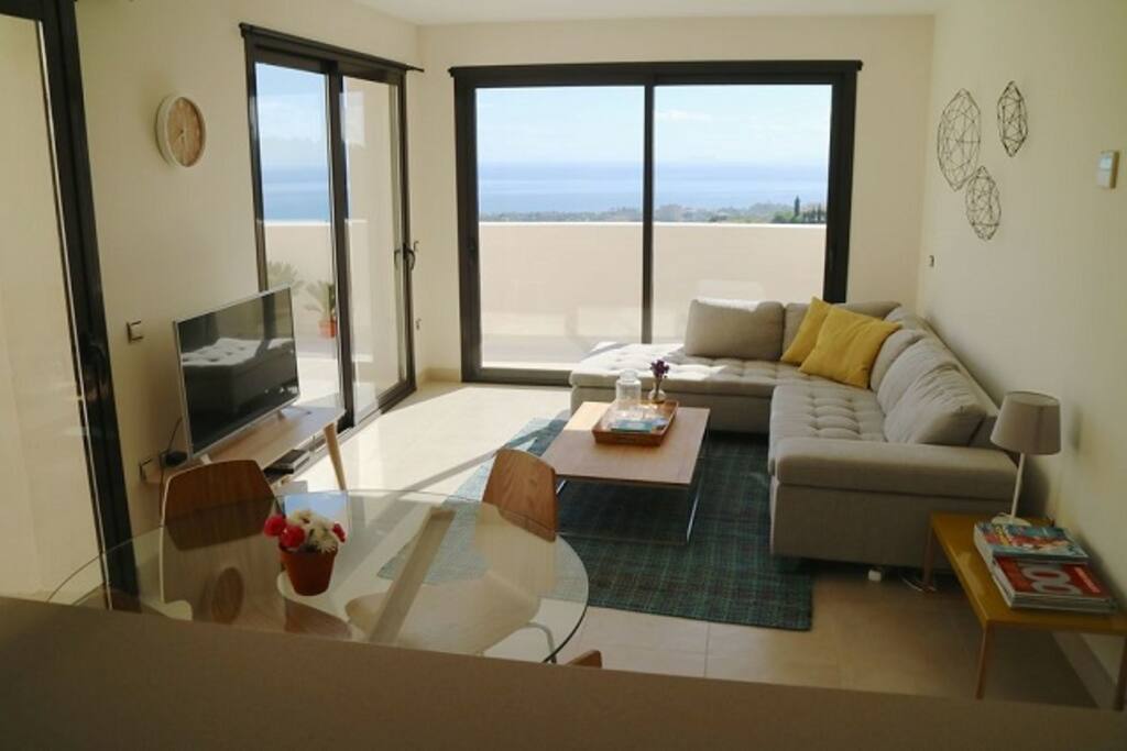 Kitchen and living room are connected with a bar table