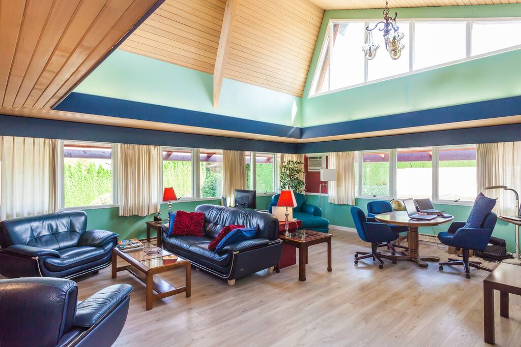 Notice the all around windows, high ceilings, comfortable seating areas and work spaces.
