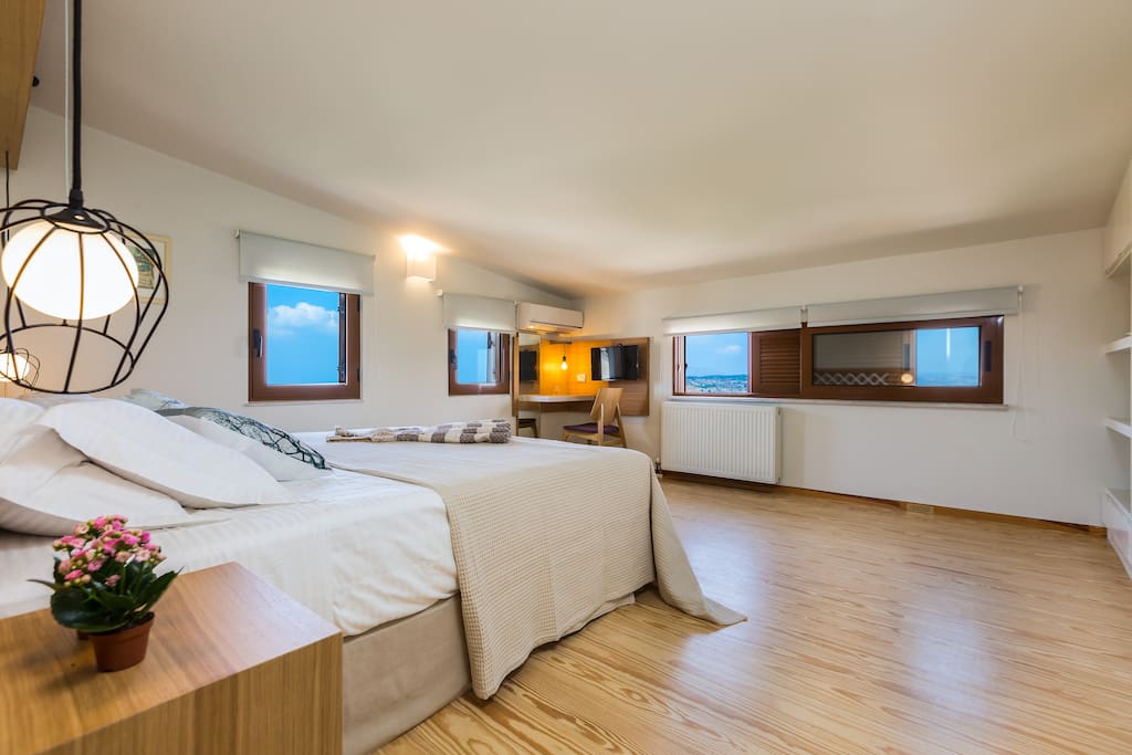 Master bedroom (1st floor): Coco-mat bed from natural materials. Window view of Apokoronas valley and the Cretan Sea