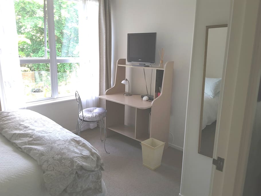 Your bedroom is clean, fresh, quiet with a garden outlook.