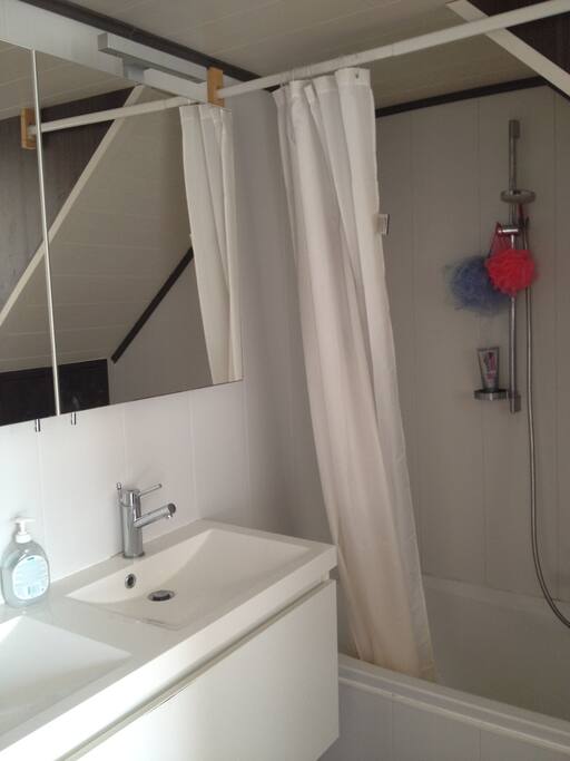 Nice and modern bathroom with bathtub.