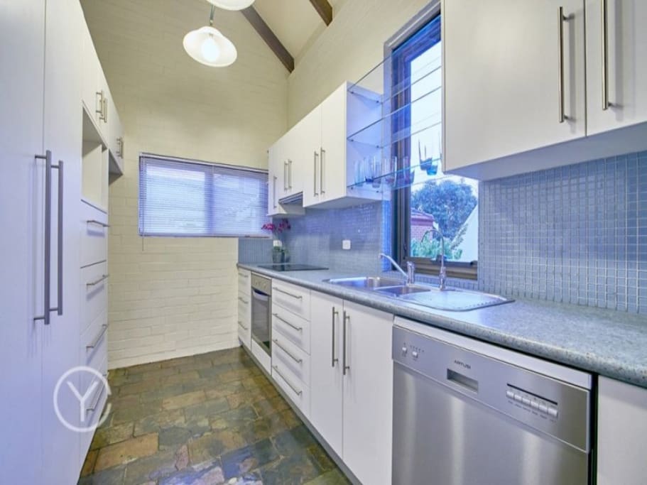 Our kitchen (with dishwasher, new oven/stovetop, fridge and microwave.)