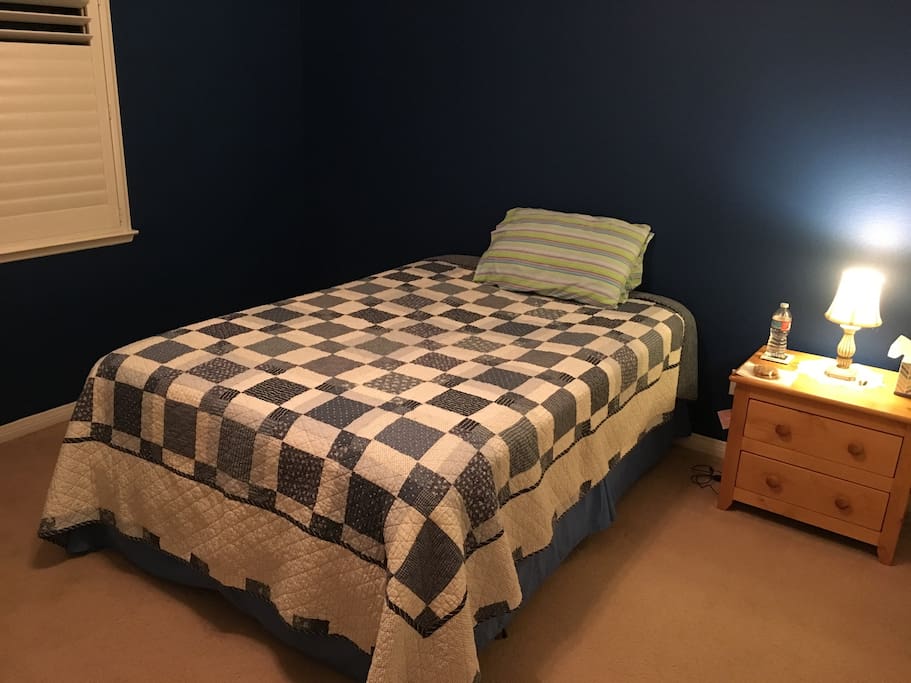 Private bedroom with a full size bed.