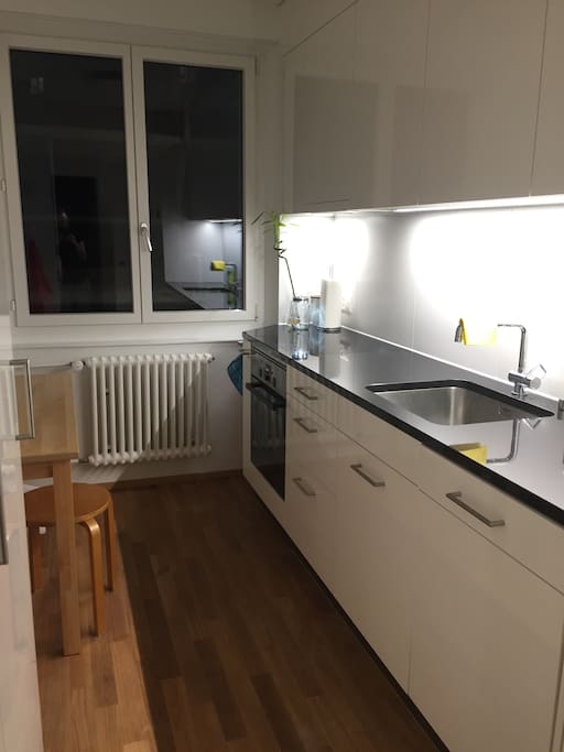 modern kitchen with dishwasher, oven, fridge, toaster, mixer...