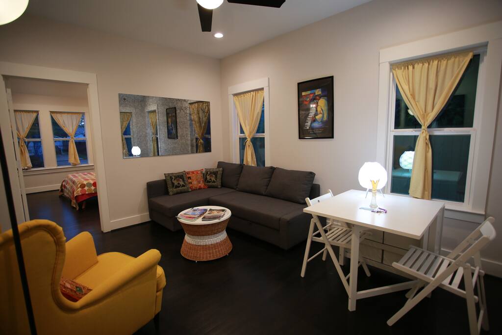 Living room/Dining room. Table folds out to seat four. Two extra chairs are stored in the closet.