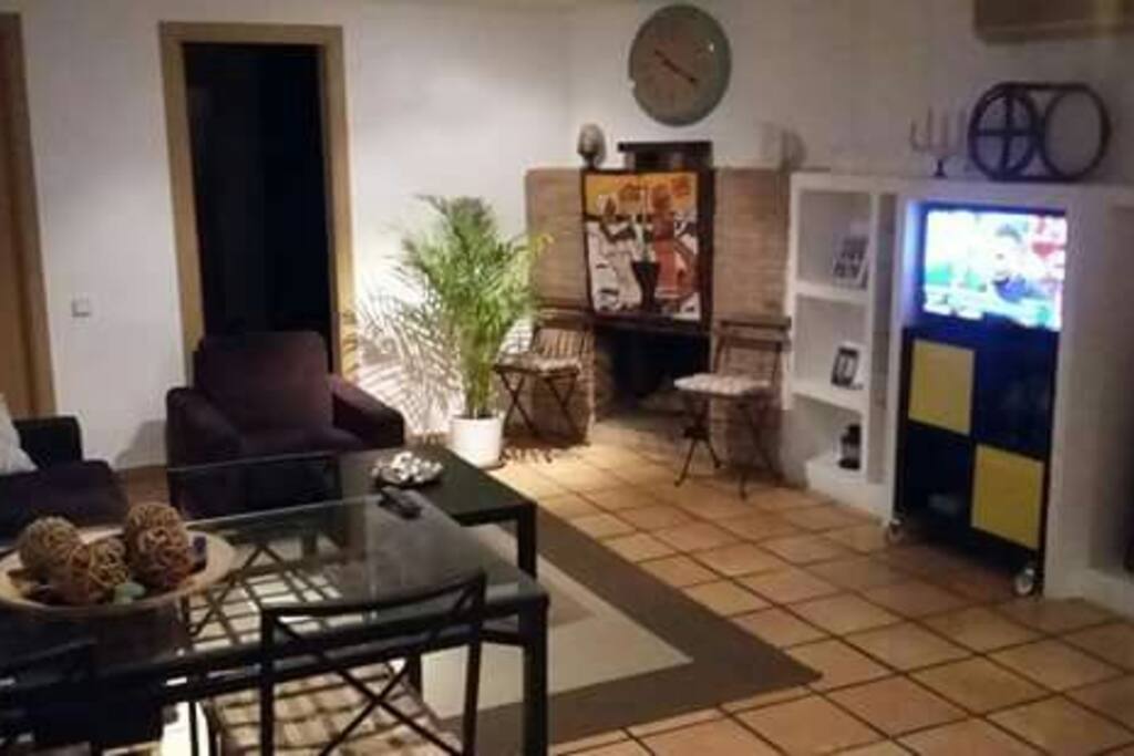 Nice living room with fireplace for cold nights.