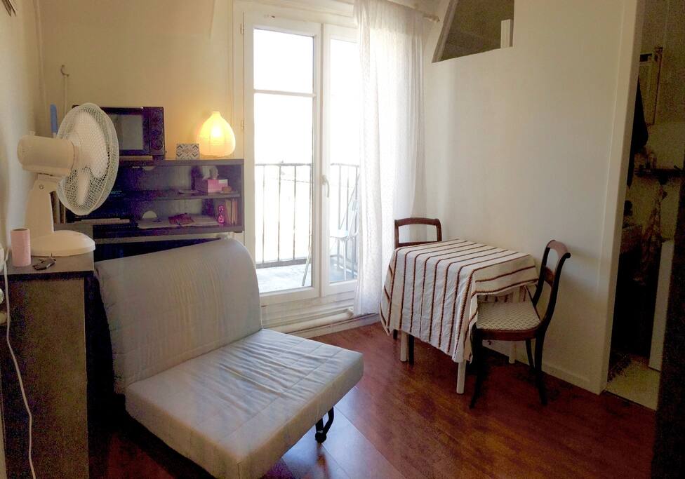 Shower and kitchen are behind the wall to the right. Table has extendible side leaves. Couch folds out to a twin bed.