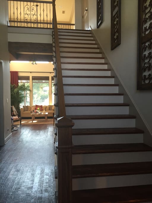 Stairs leading to the upstairs just inside the front door